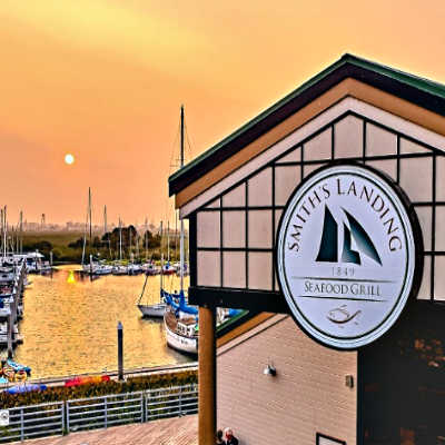 Boats, Marina and front door sign of Smith's Landing Seafood Grill Restaurant, Antioch.