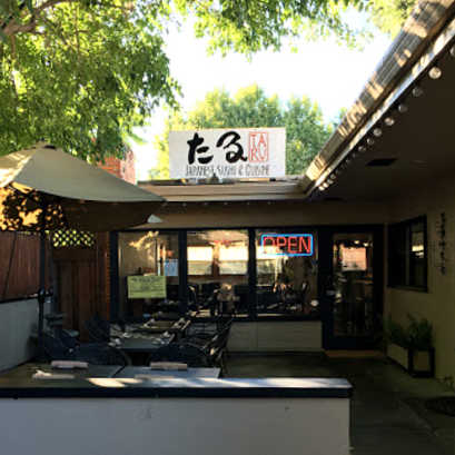 Lit Open neon sign in front window of Taru Japanese Restaurant, Danville, CA