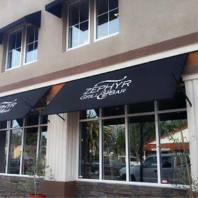 Logo awnings in front of Zephyr Grill & Bar, Brentwood, CA